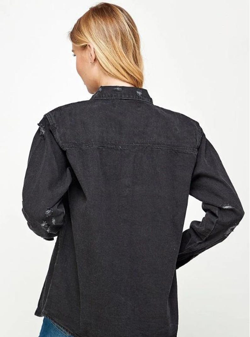 Black distressed rhinestone nativity jacket detail
