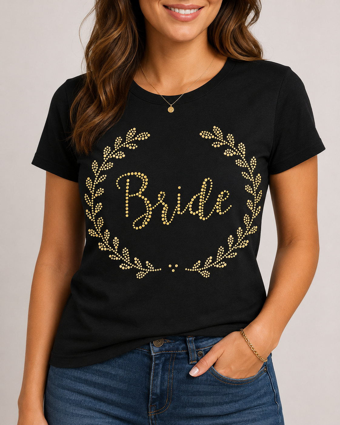 Black bridal T-shirt mockup with a gold rhinestone Bride laurel wreath design